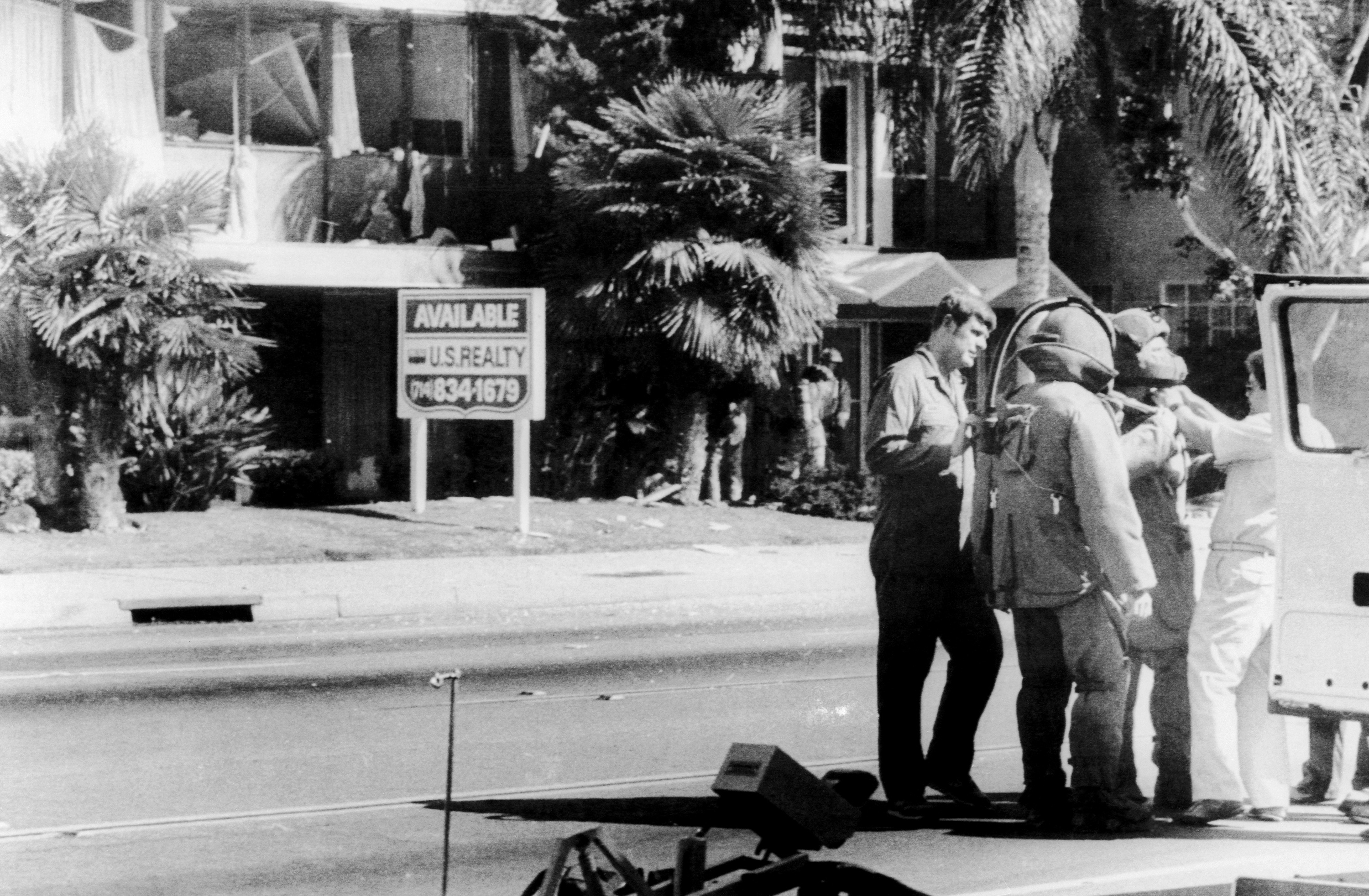 Members of the bomb squad prepare to examine the wrecked offices of the American-Arab Anti-Discrimination Committee offices in Santa Ana, Calif. The West Coast director of the ADC, Alex Odeh, was killed in the blast. On 12/5 the FBI announced it had begun an investigation of the recent attacks on ADC offices.