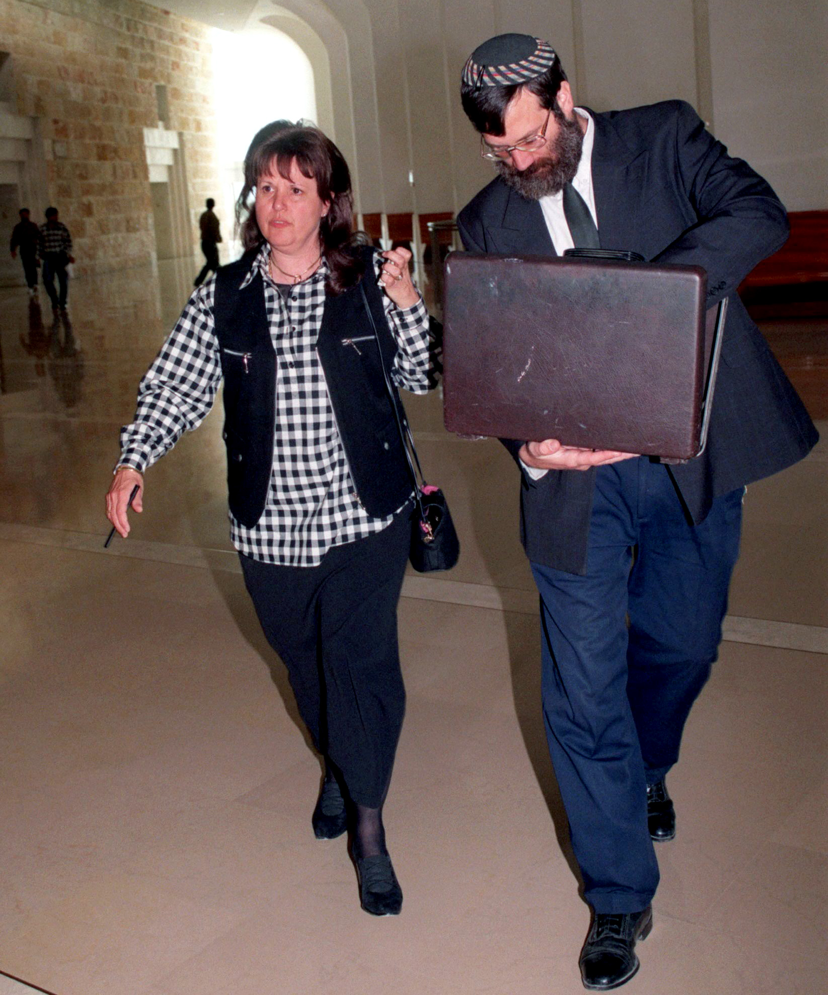 Esther Pollard, wife of convicted spy Jonathan Pollard, walks with her lawyer Baruch Ben-Yosef in the Supreme Court November 16. Jonathan Pollard petitioned the high court to block the release of hundreds of Palestinian prisoners being held in Israeli jails until he is freed. The petition said that U.S. President Bill Clinton promised during lat month's Wye Middle East peace summit to free Pollard in exchange for Israel's release of Palestinian prisoners. JWH/ME - RP1DRIFSOHAB