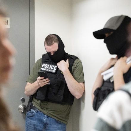 ICE agents are seen waiting outside a courtroom in the hallway of federal immigration court in Lower Manhattan, NY on Friday, June 20, 2025.